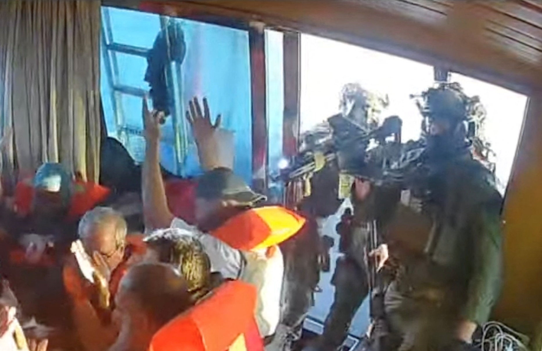 A screengrab from a livestream shows Israeli navy forces aboard the Gaza-bound vessel Florida, part of the Global Sumud Flotilla, which organizers say was intercepted Oct. 2, 2025. (Global Sumud Flotilla via Reuters)